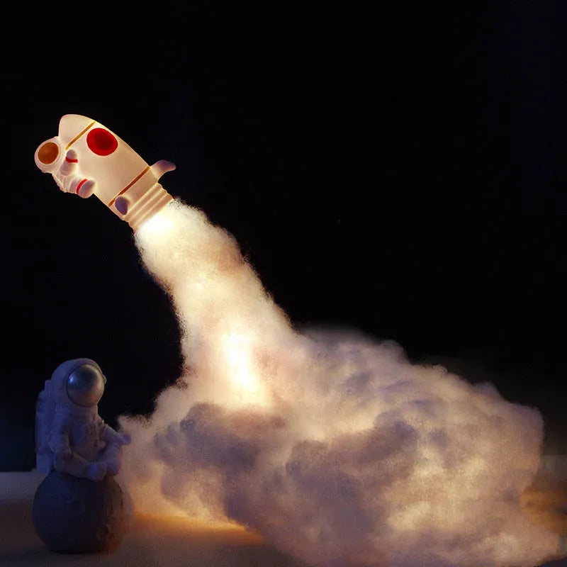 DIY astronaut rocket night light kit components including rocket model, LED string lights, chassis and assembly materials