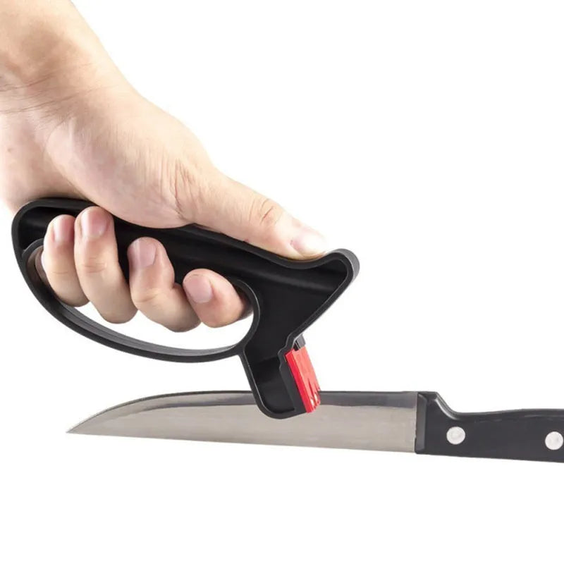 Black handheld knife and scissor sharpener tool on a white background.