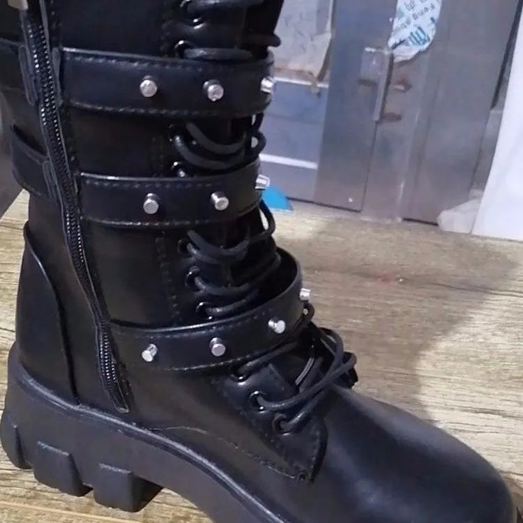Women's black mid-calf boots with round toe, side zip, and adjustable metal buckle strap.