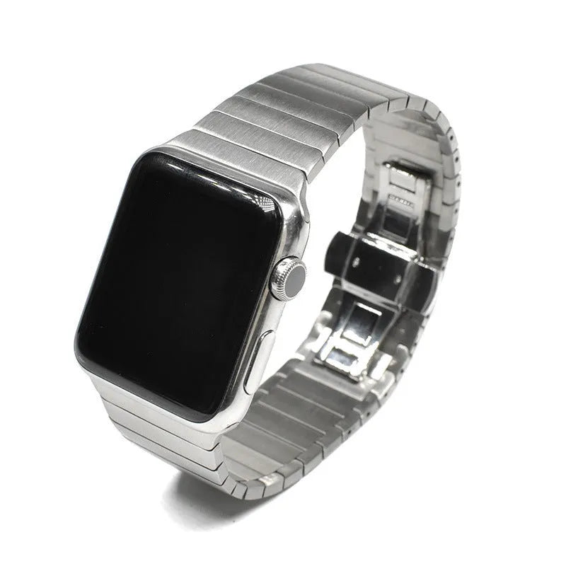 Silver metal Apple Watch strap with butterfly buckle on a 40mm watch case.