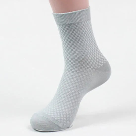 A pair of men's bamboo fibre socks in a classic colour, showing the small square pattern and medium thickness.