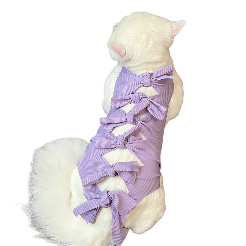 Lace-up polyester recovery clothing for a cat, shown in a choice of colours including blue, pink, and green pineapple.
