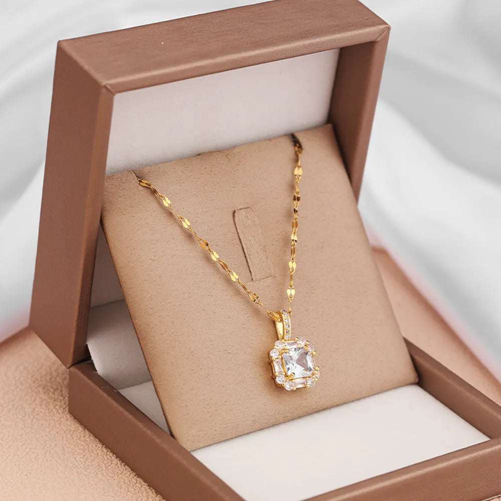 Women's titanium steel geometric zircon clavicle chain necklace with water wave chain in gold.