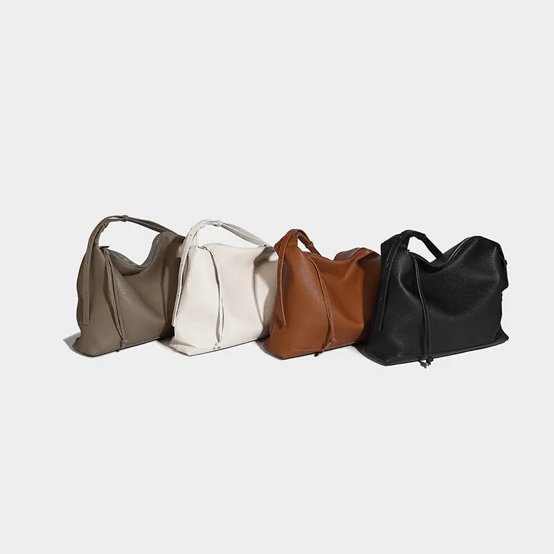 Large soft PU messenger bag in caramel colour showing 36cm length and shoulder strap