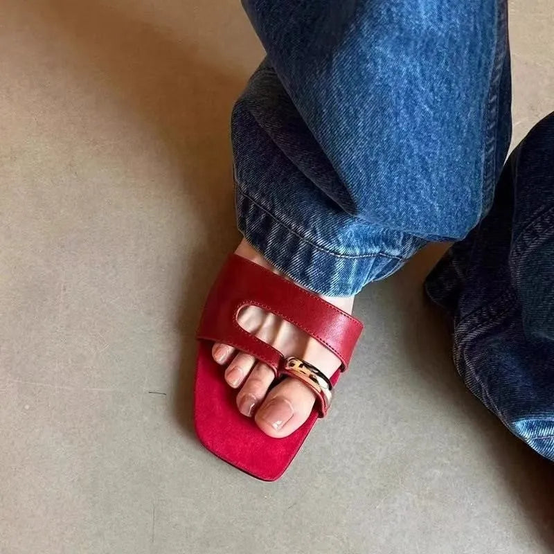 Plus size leather outdoor slippers with square toe in red, white, black, and silver on a rubber sole.