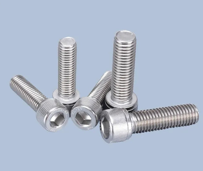 Stainless steel turntable cartridge mounting kit with allen bolts, nuts, washers, and two allen keys on a grey background.