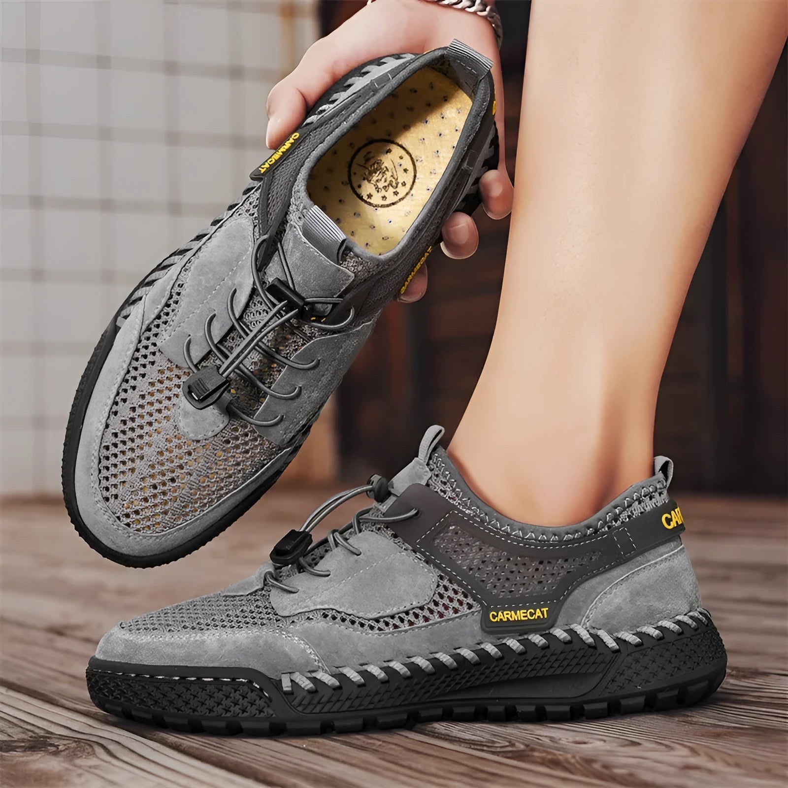 Men's brown suede casual tennis shoes with an elastic band and hand-stitched rubber sole.