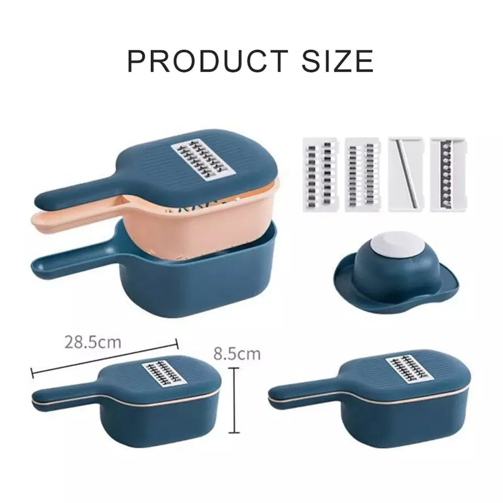Dark blue vegetable cutter with four stainless steel blades, drain basket, and hand protection guard on kitchen counter