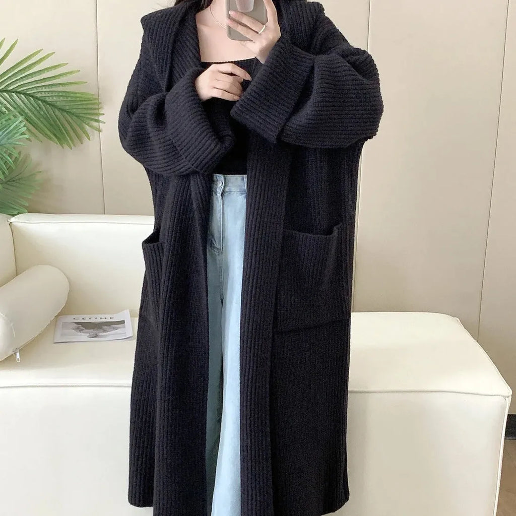Loose grey hooded cardigan coat for women with raglan sleeves, shown open as an oversized layer.