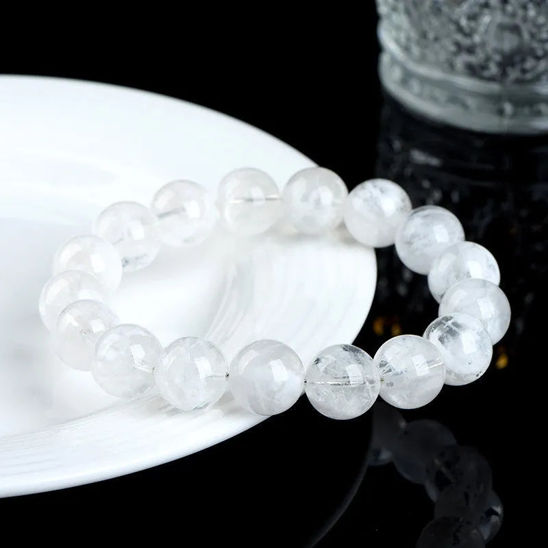 Women's crystal bracelet with blizzard snowflake round beads and Ruyi design in geometric shape.