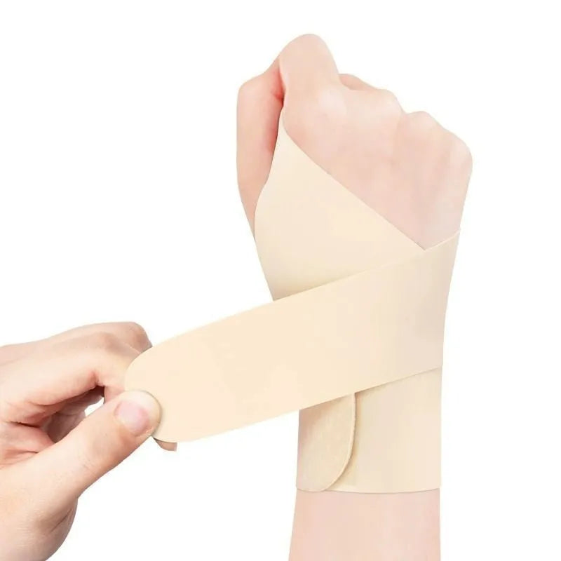 Adjustable black athletic wristguard shown on a wrist, suitable for badminton, tennis, and volleyball.