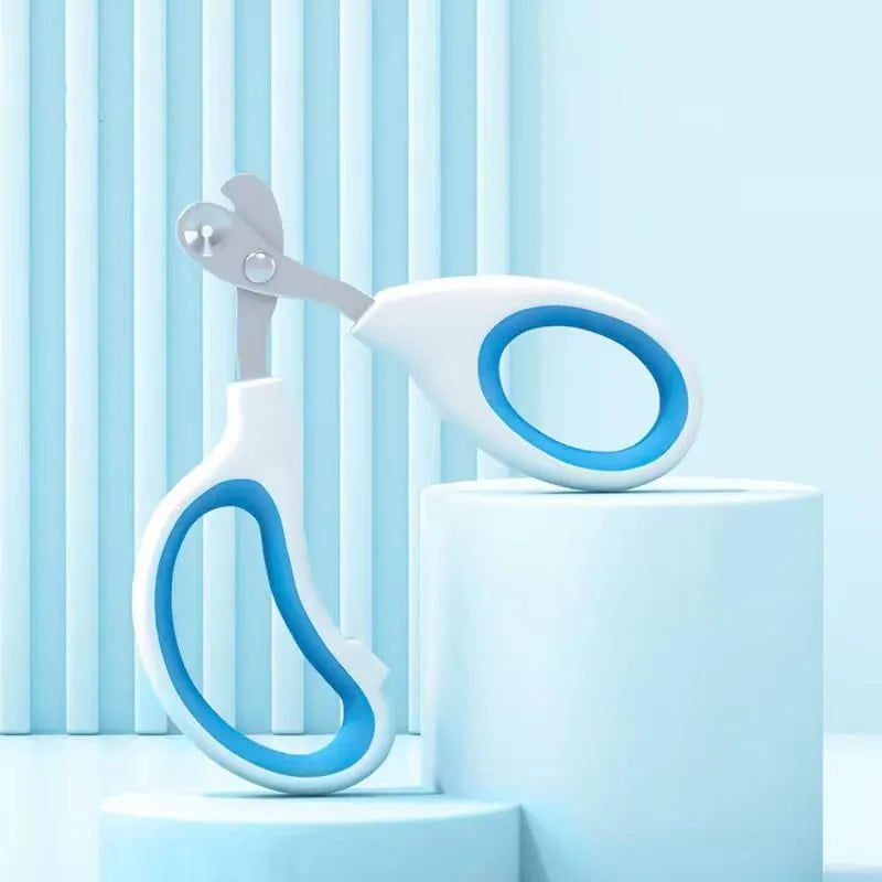 Blue pet nail clippers with a circular hole for the nail, showing the stainless steel blades and cushioned handles.