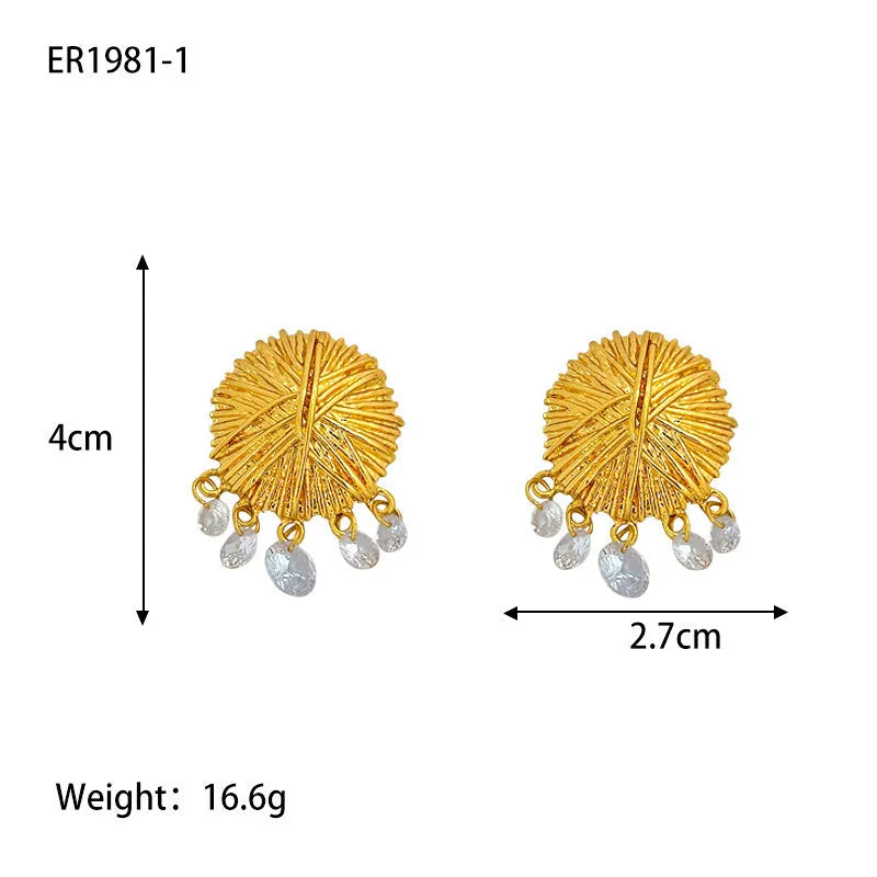 Geometric gold metal hoop earrings with round design elements