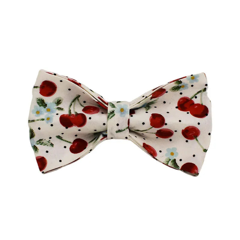 Red cherry print dog collar set with matching leash, vest, and light gold buckle
