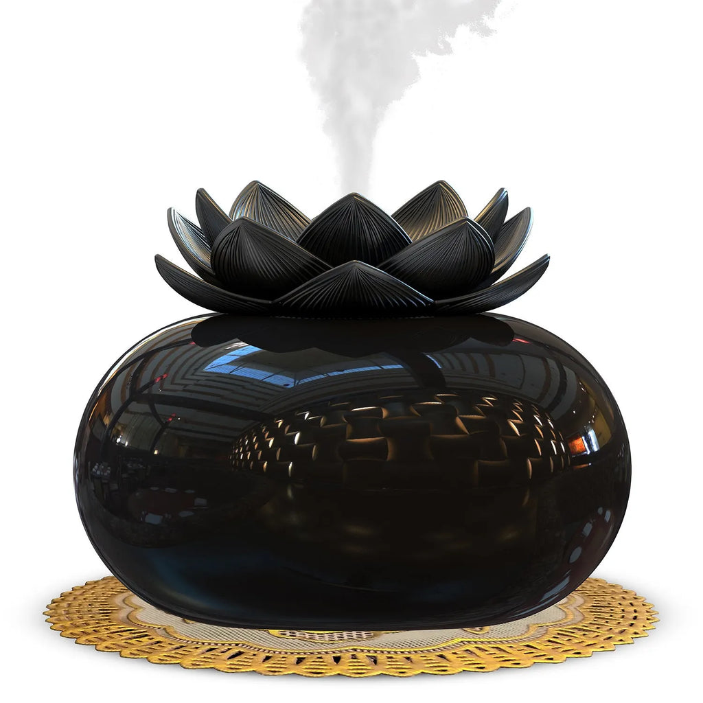 Pure black lotus-shaped USB aromatherapy humidifier on a desk.