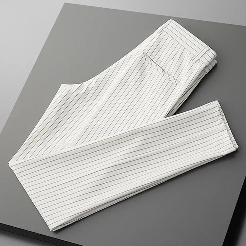 Men's loose-fitting striped casual trousers in black and white colours showing trousers and crop jeans styles