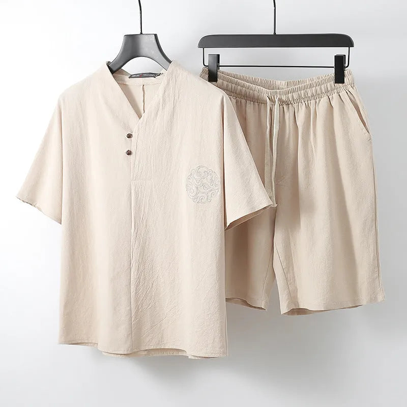 A loose-fit men's two-piece clothing set showing a short-sleeve top and matching shorts in a cotton fabric.
