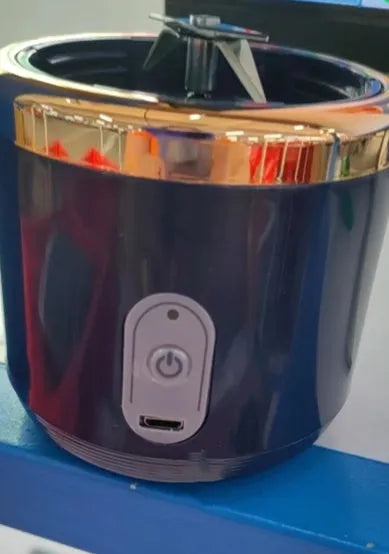 Portable dark blue blender and juicer with six blades, USB charging cable, and 400ml plastic cup.