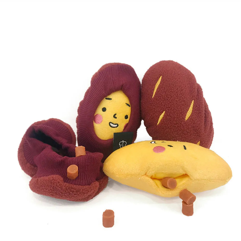 Red fabric pet toy shaped like sweet potato with internal hidden treat pockets for dogs