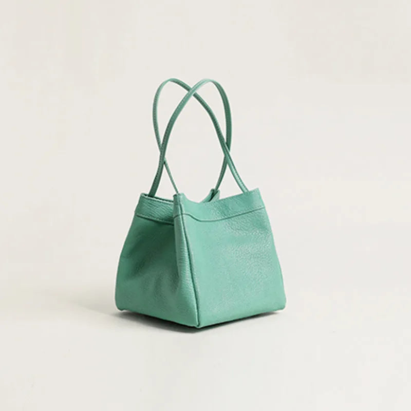 Cute small square bucket bag for women in textured PU, available in six solid colours including green and black.