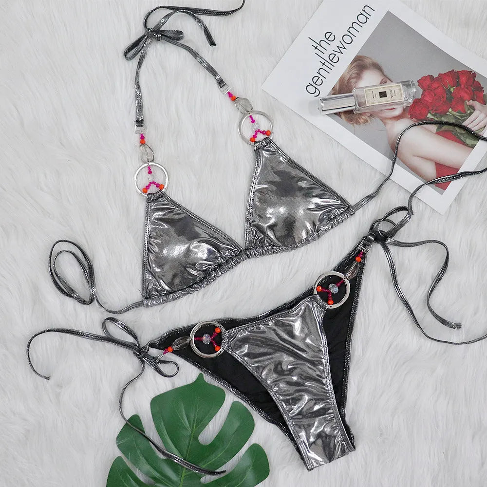 Silver women's two-piece bikini swimsuit with high-cut briefs on a mannequin.