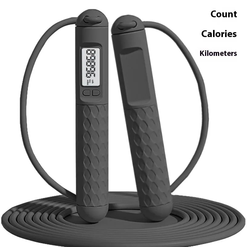 Fitness skipping rope with bearing handles in various colour and cord style options including black, green, navy blue, and purple.