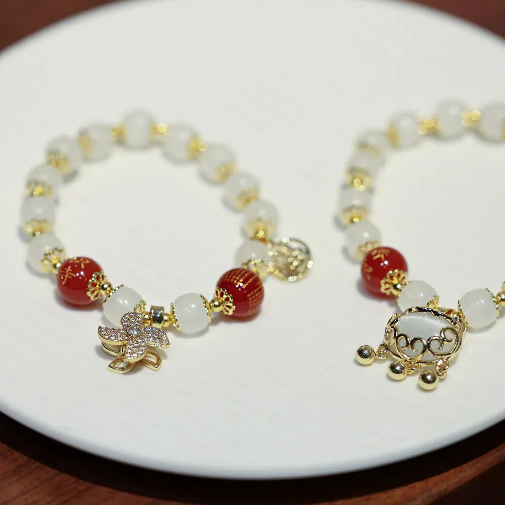 Chinese style women's coloured glass bracelet with safety lock and windmill charms