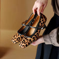 Women's black square toe stiletto heel ankle-strap shoes with horse hair uppers and buckle closure