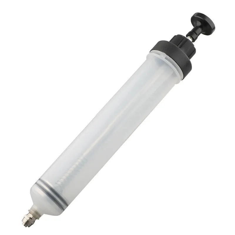 Manual oil pump tool with syringe-style barrel for suction and injection fluid transfer