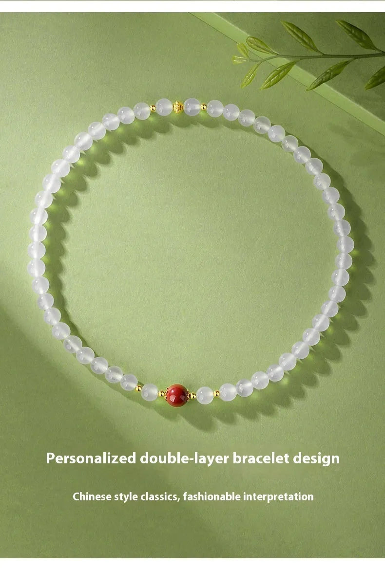 White double layer agate bracelet with 6mm geometry-shaped beads on a wrist