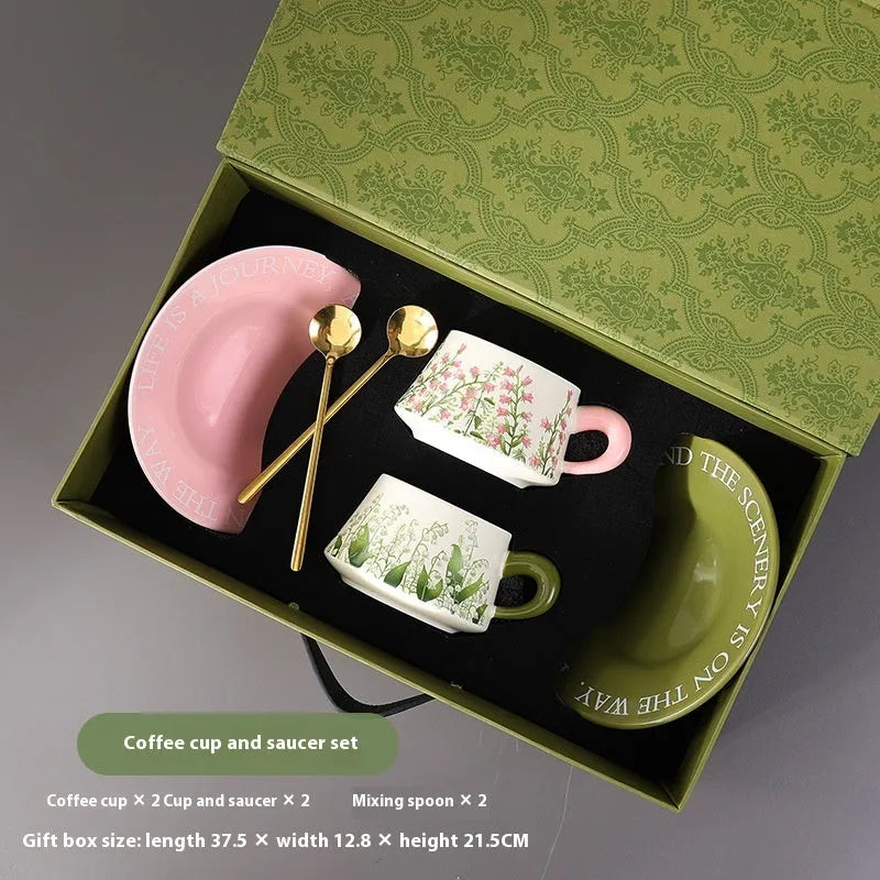 Ceramic coffee cup and saucer set for two with stirring spoons in Hanging Bell or Lanling Grass patterns.