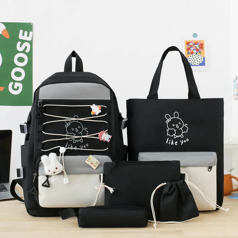 Lightweight large student backpack in black, blue, pink, and purple colour options.