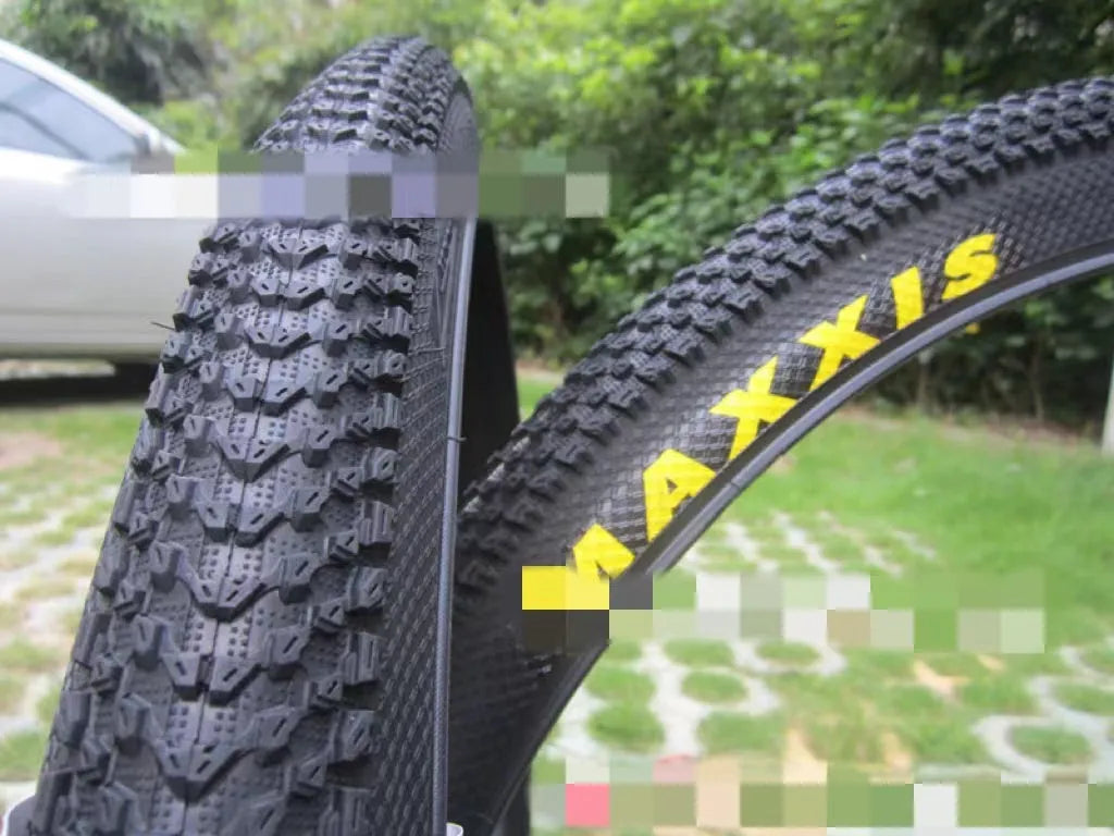Ultralight puncture-proof mountain bike tyre showing tread pattern and sidewall in available sizes