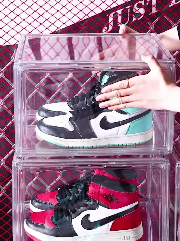 Clear acrylic shoe storage box with magnetic side door showing visible shoe organisation