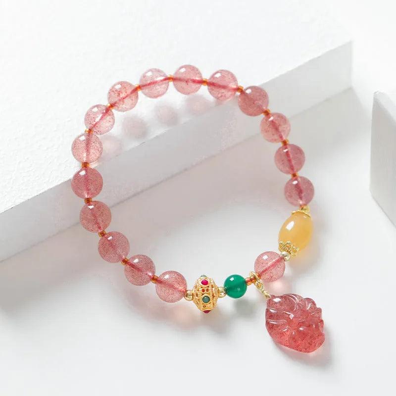 Women's crystal bracelet with strawberry quartz beads in nine tail fox design
