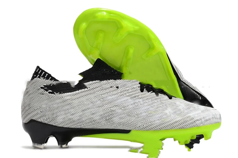 Men's black football boots with knit upper, lace-up front, and rubber FG studded sole.