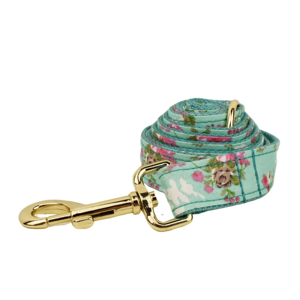 Rose floral pattern dog collar and leash set with green background, detachable bow, and matching dog vest