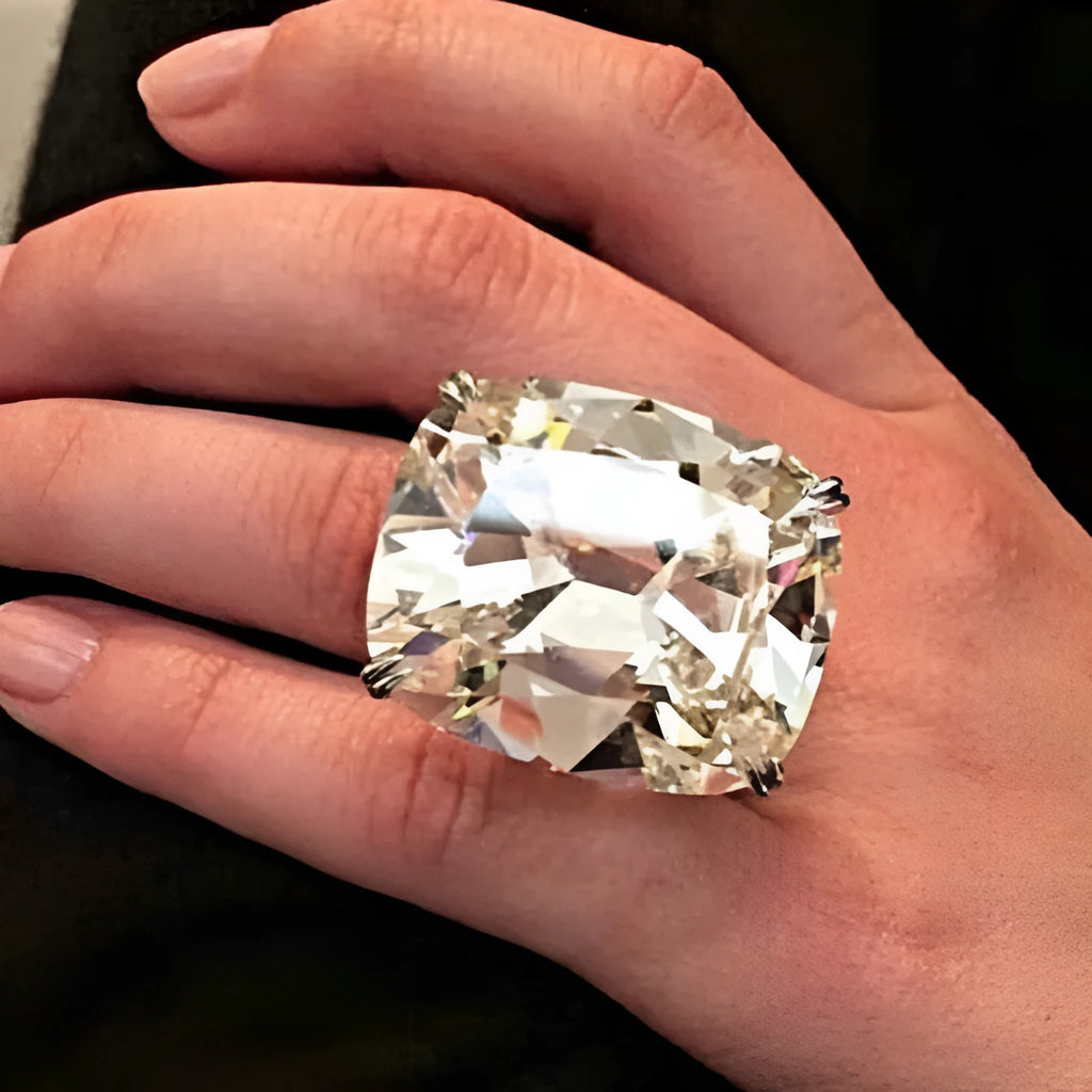 Women's white gold colour geometric ring with inlaid square diamond design on finger