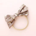 Children's cloth hair band with knotted bow design showing Snow White princess pattern