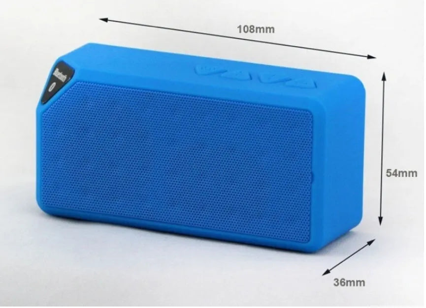 Small cube-shaped Cannon X3 portable Bluetooth speaker in multiple colour options on a table.