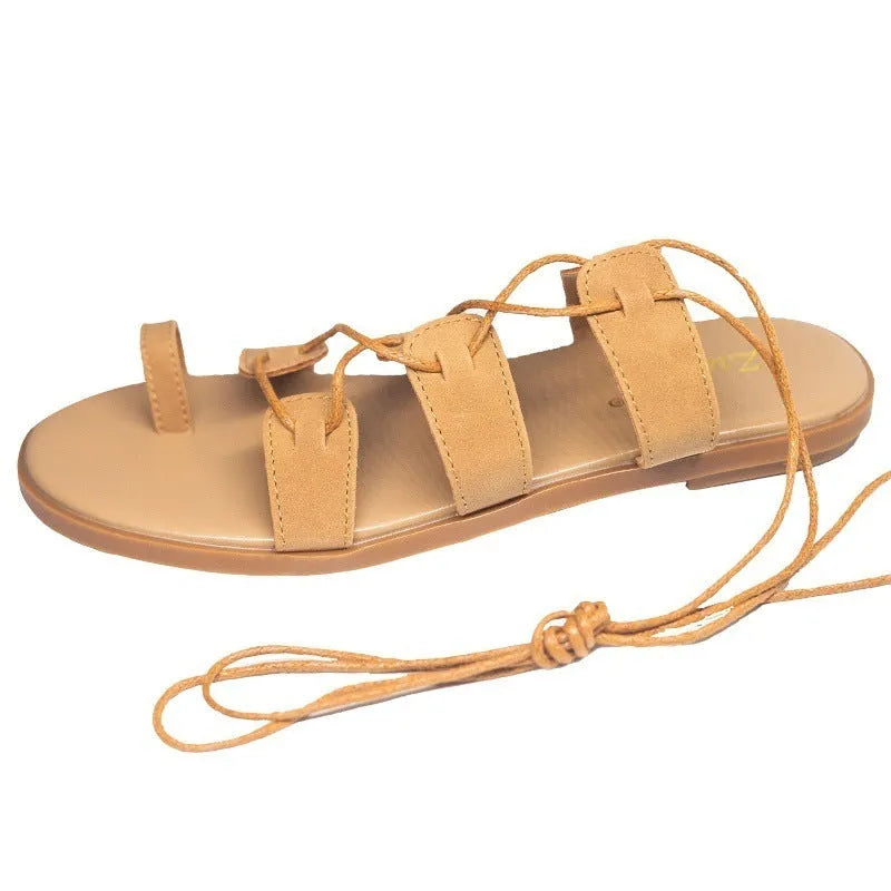 Brown patent leather Roman flip flops for women with flower and bow decorations, rubber sole