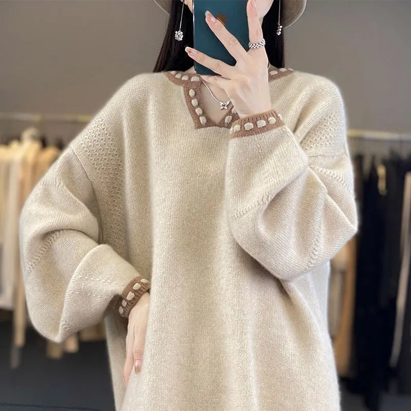 Women's white V-neck pullover sweater with regular long sleeves showing front view