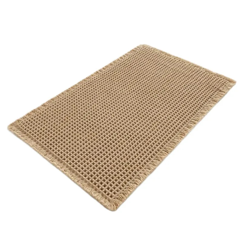 A square, checkered-pattern bathroom carpet in a choice of colours on a tiled floor.