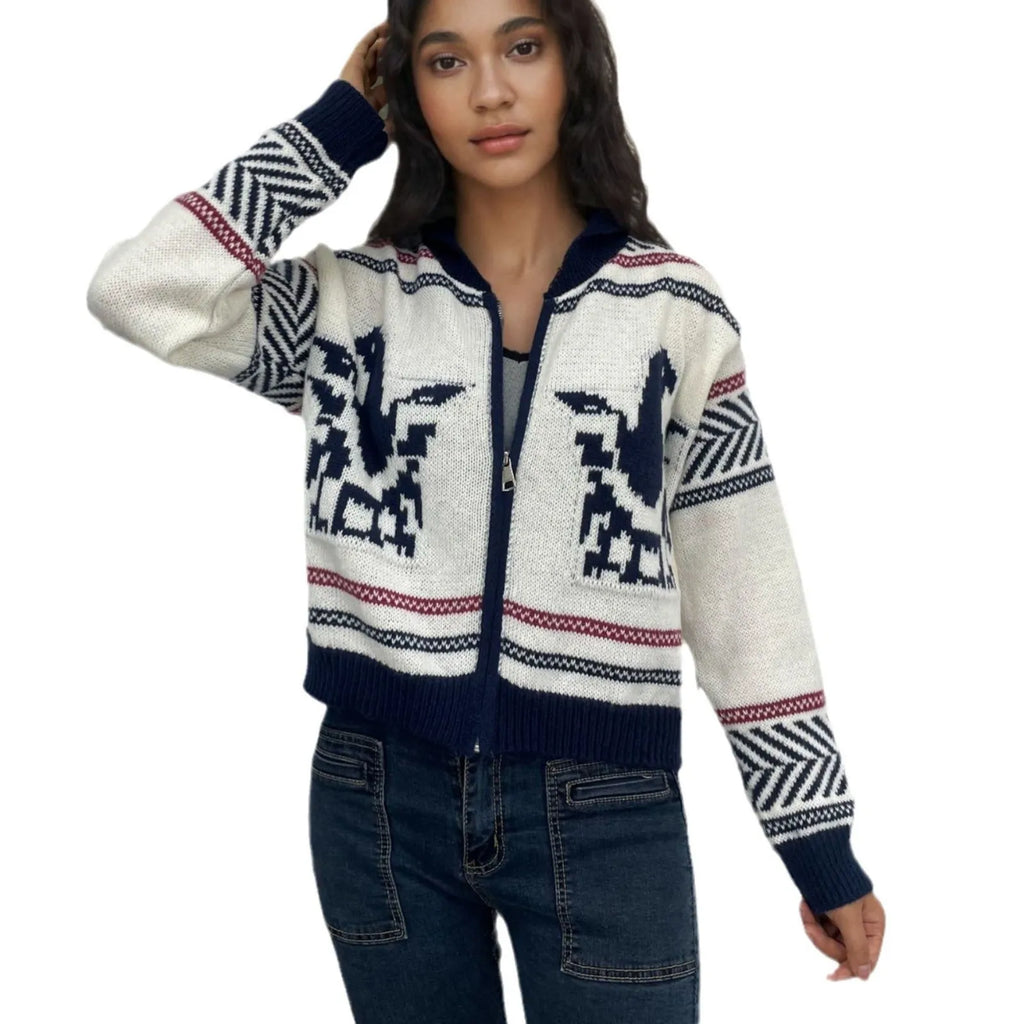 White women's cardigan with front zipper, lapel collar, and contrasting stripe jacquard pattern.