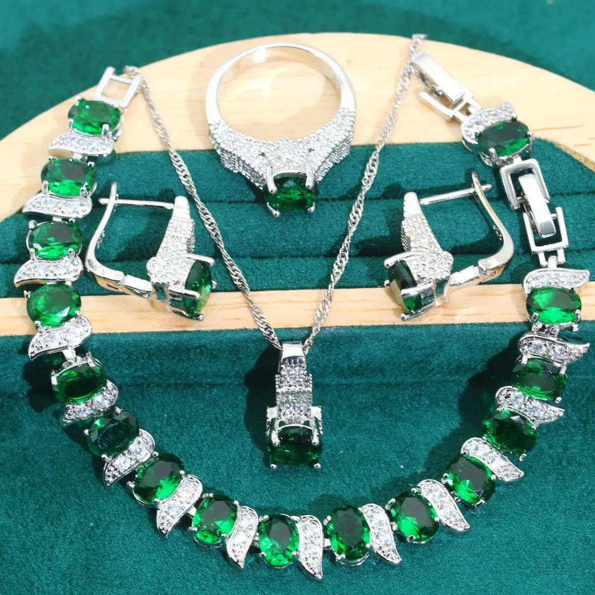 Bridal four-piece jewellery set showing necklace, earrings, ring and bracelet with water wave chain design