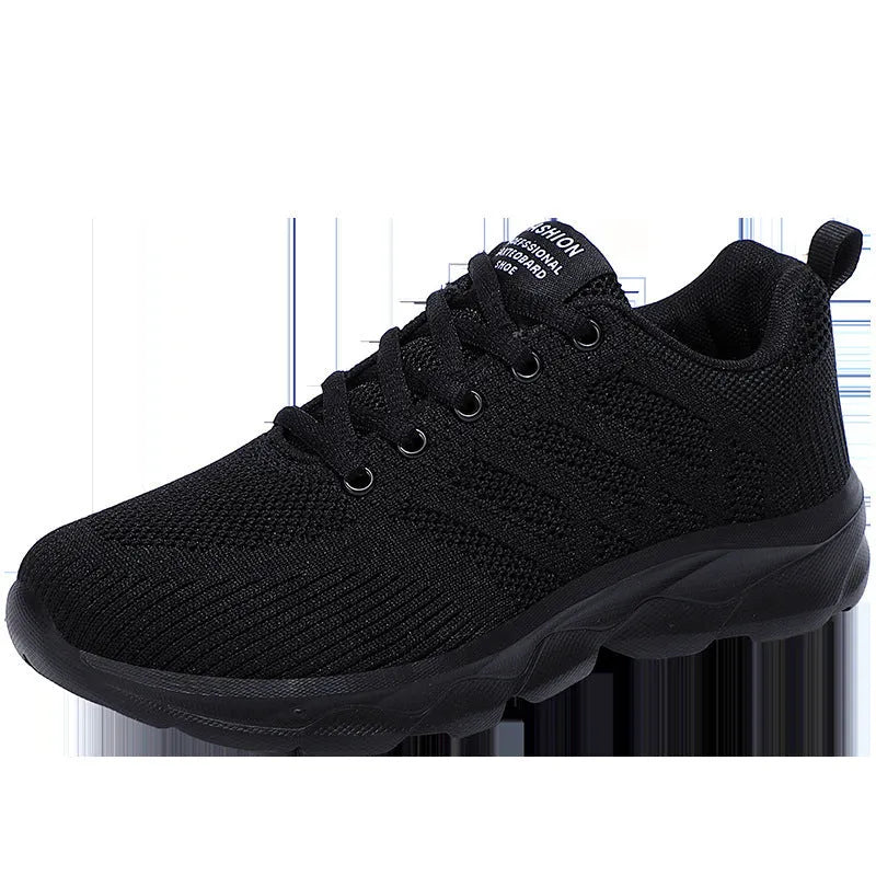 Women's white mesh lace-up leisure shoe with round toe and low heel on a plain background.