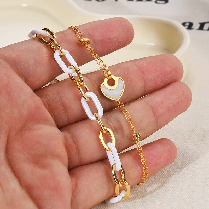 Double-layer stainless steel and resin heart bracelet for women with electroplated finish