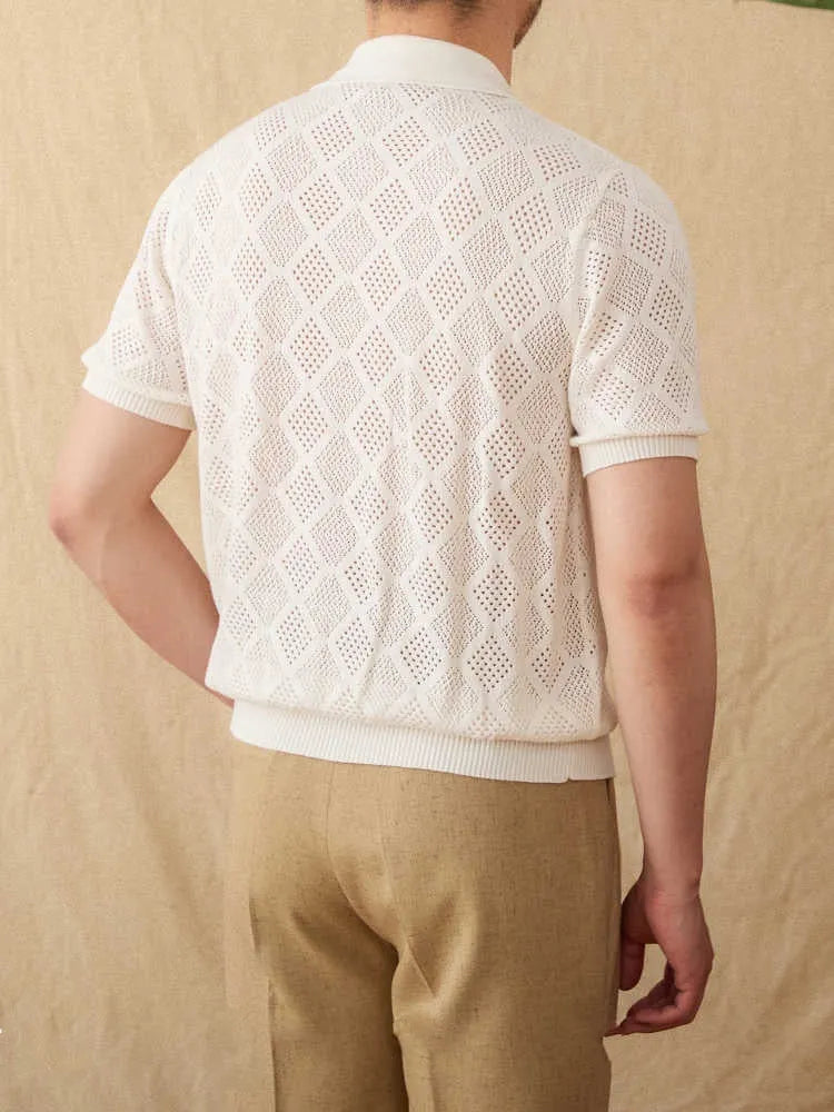 Light brown cotton short sleeve cardigan with front zipper and lapel collar laid flat.