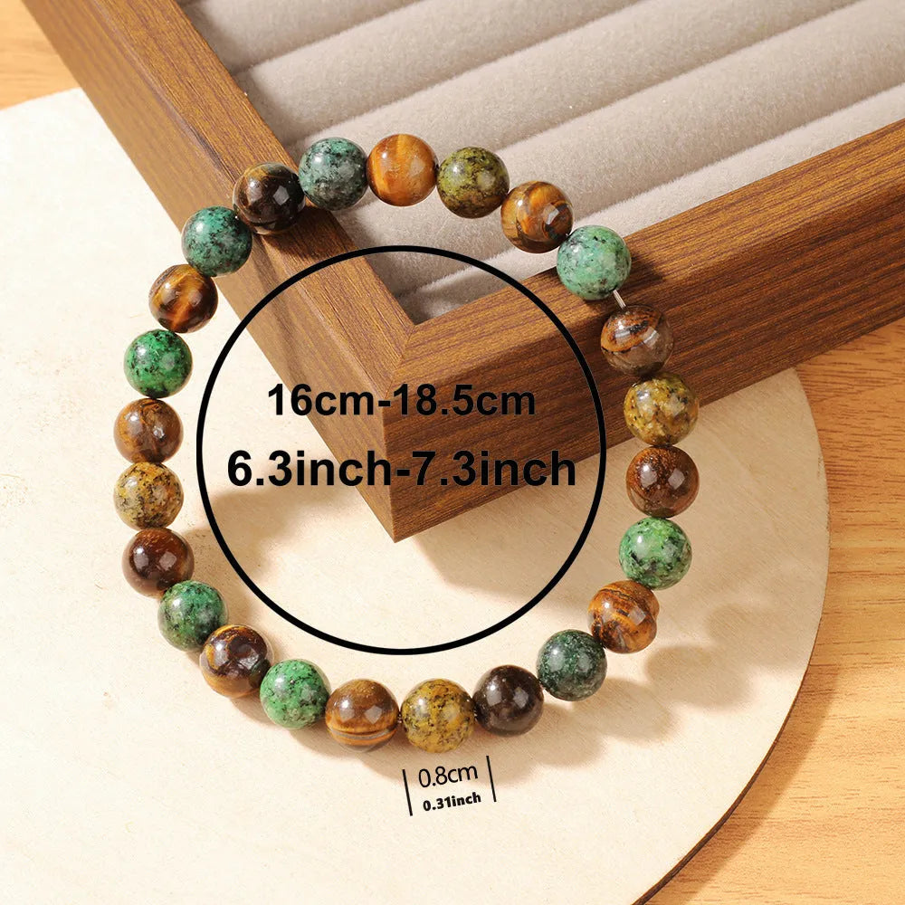 Handmade Tigereye stone fortune bracelet with antique style floral carving measuring 18mm