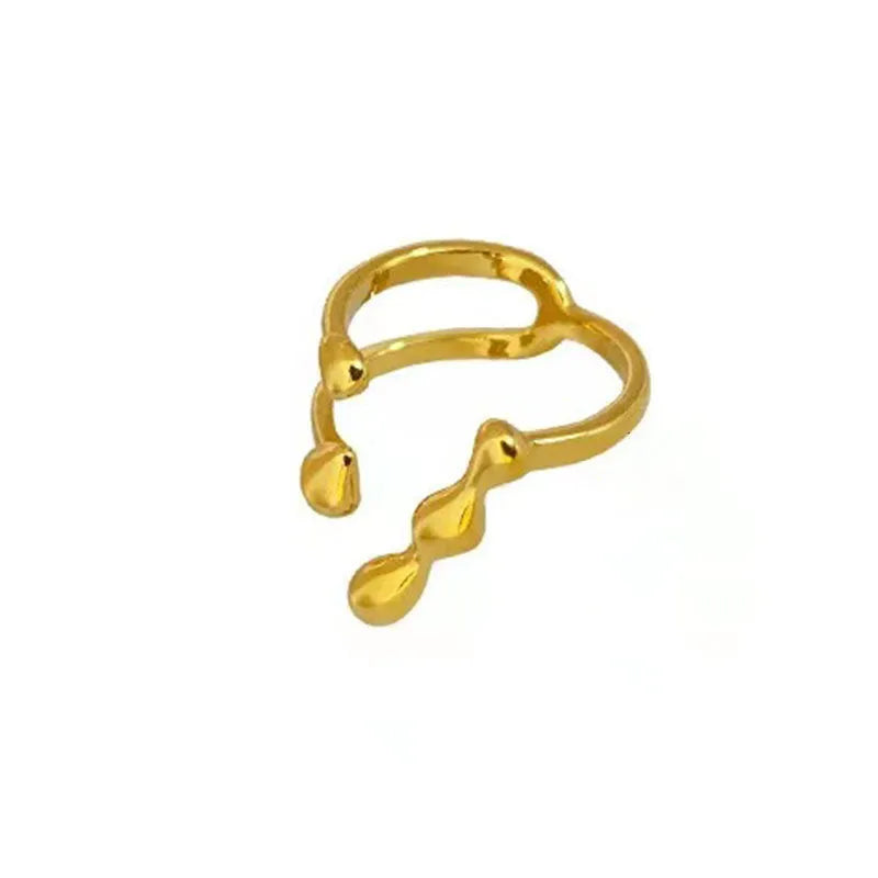 Brass spherical ring with circular design elements in gold or silver finish